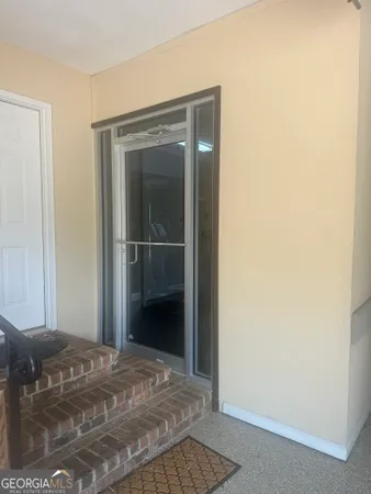 a view of a bedroom from the hallway