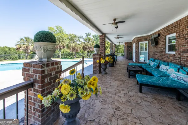 a front view of a house with outdoor seating