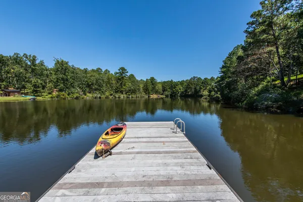 a lake view with a wooden bridge