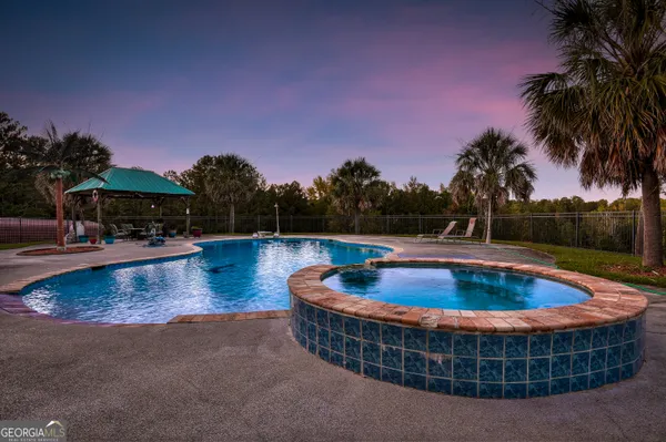 a view of swimming pool with outdoor seating yard and kitchen