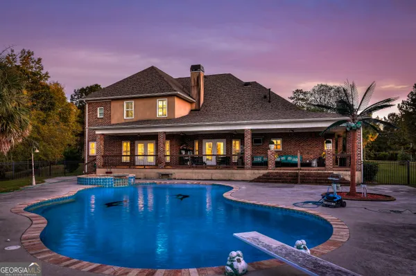 a view of a house with swimming pool