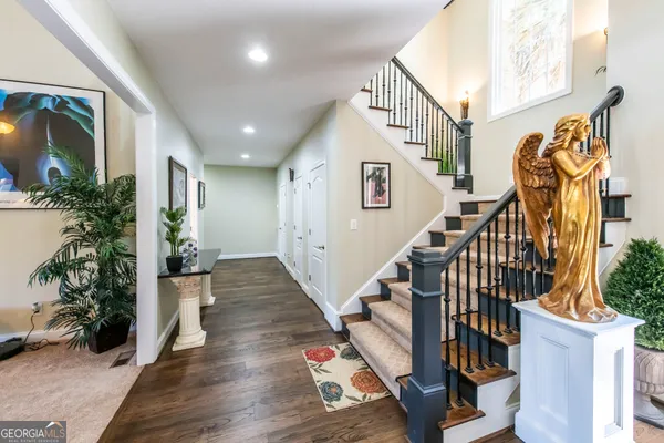 a view of entryway with wooden floor and a chandelier