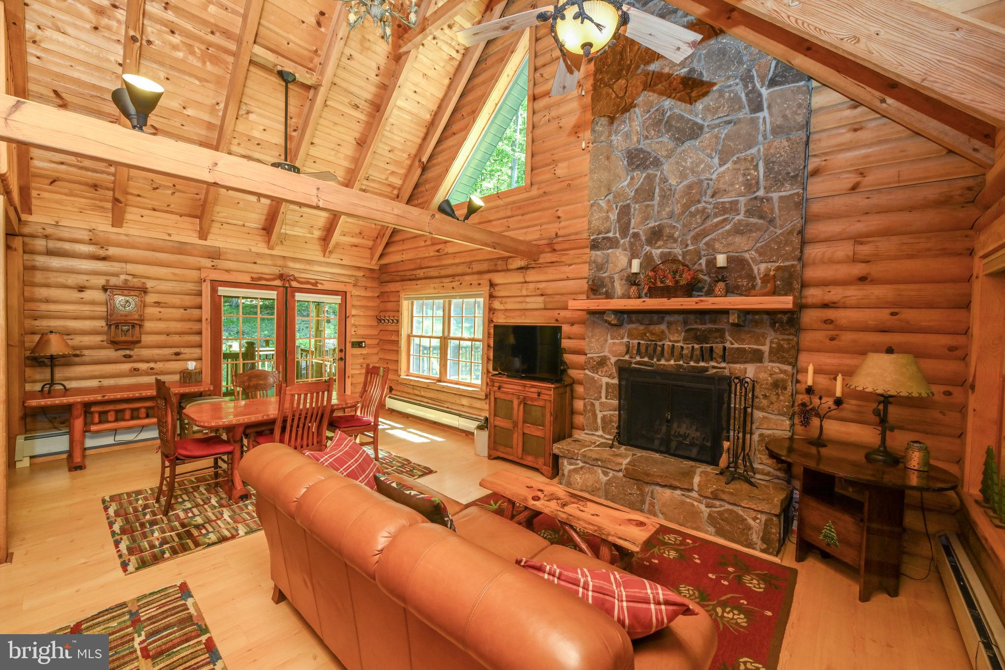 Floor to ceiling stone wood burning fireplace.