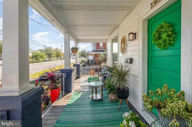 a living room filled with furniture and a potted plant
