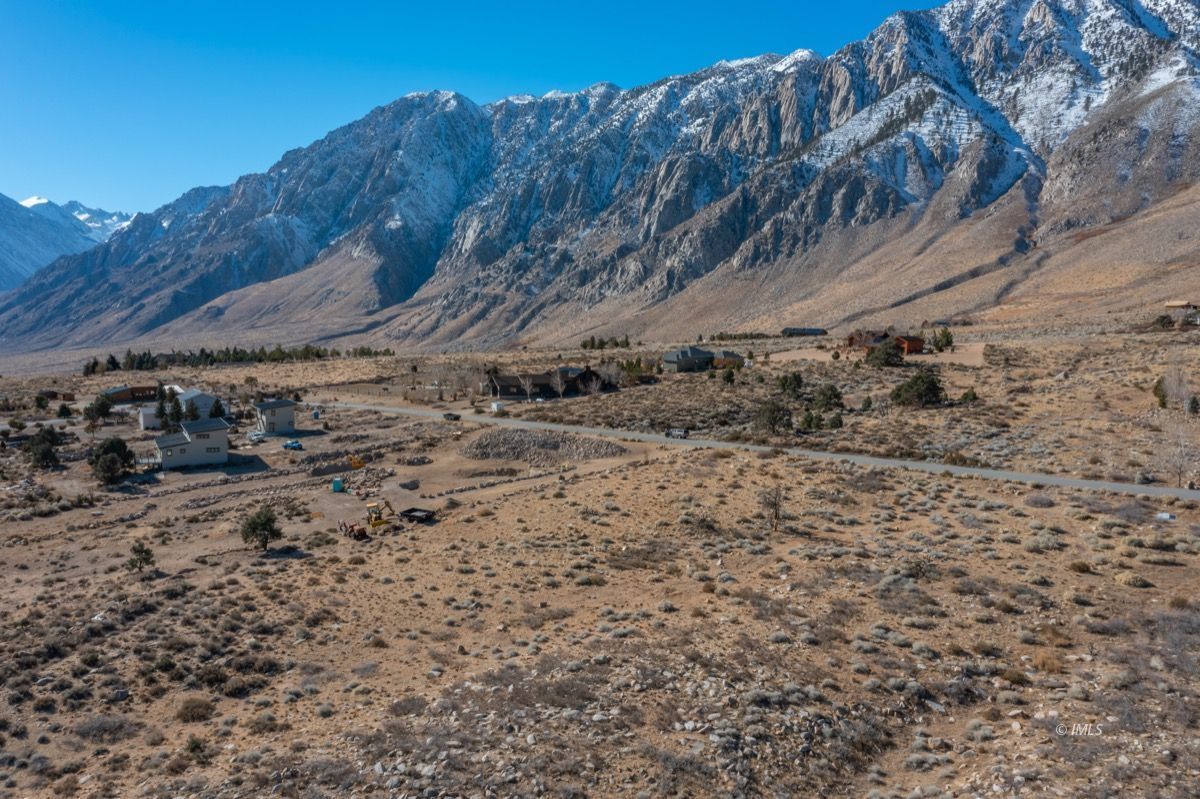 Rimrock Drive Bishop, CA 93514 - Photo 12 of 35 a view of a dry yard with mountains and a mountain view