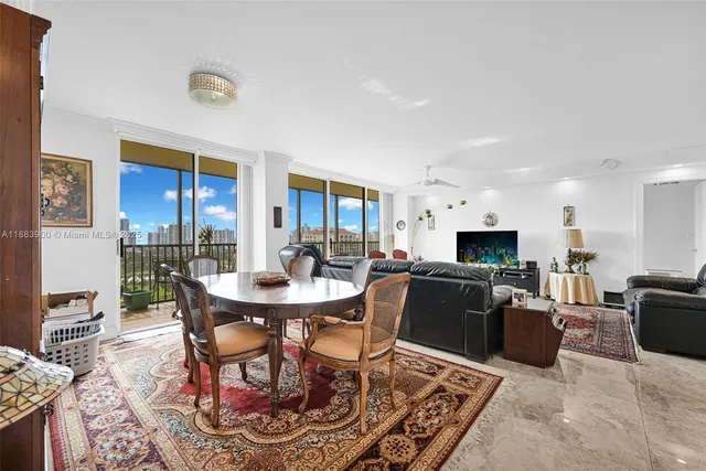 a dining room with furniture and window