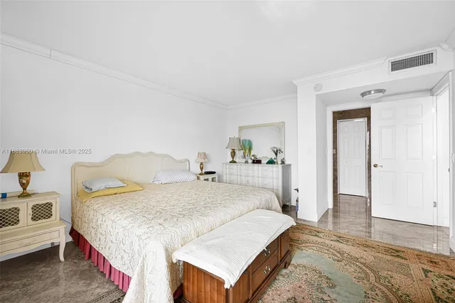 a spacious bathroom with a double vanity sink toilet and a mirror