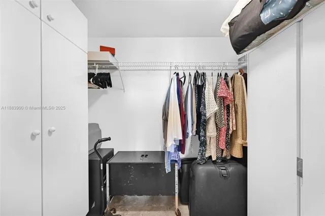 a bedroom with furniture and a wooden floor