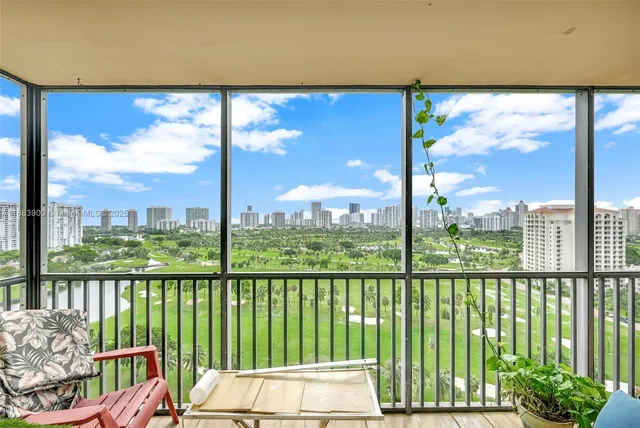 a view of a balcony with wooden floor