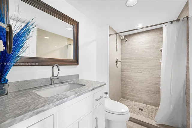 a spacious bedroom with two beds and a couch