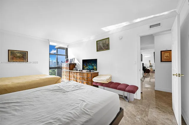 a bedroom with bed and a desk