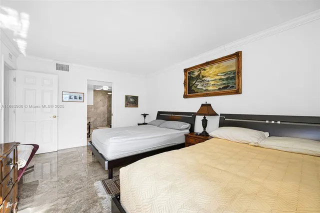 a bathroom with a granite countertop sink mirror and toilet