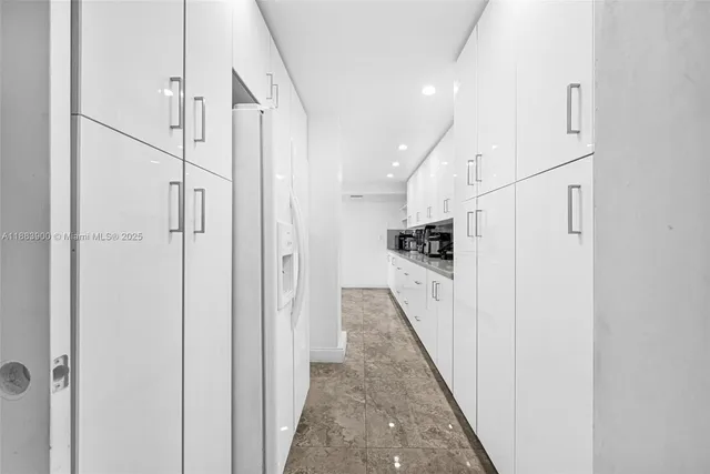 a kitchen with stainless steel appliances a refrigerator and a sink