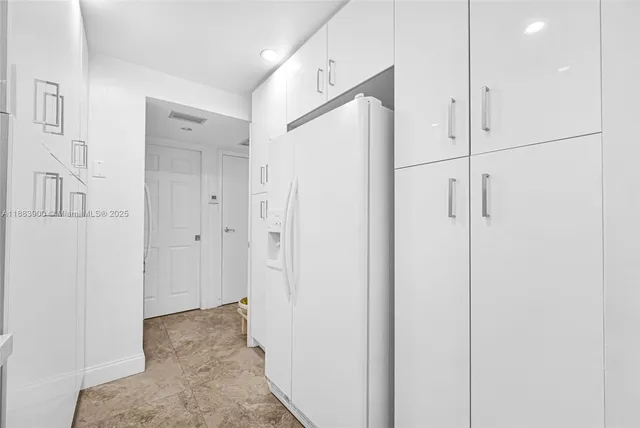 a kitchen with stainless steel appliances granite countertop a sink and a stove