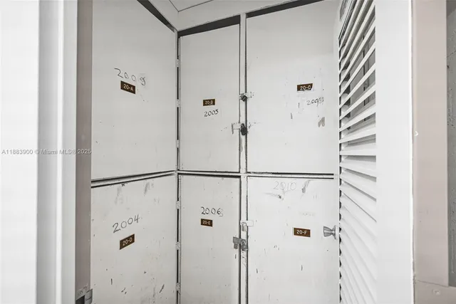 a view of kitchen with microwave and cabinets