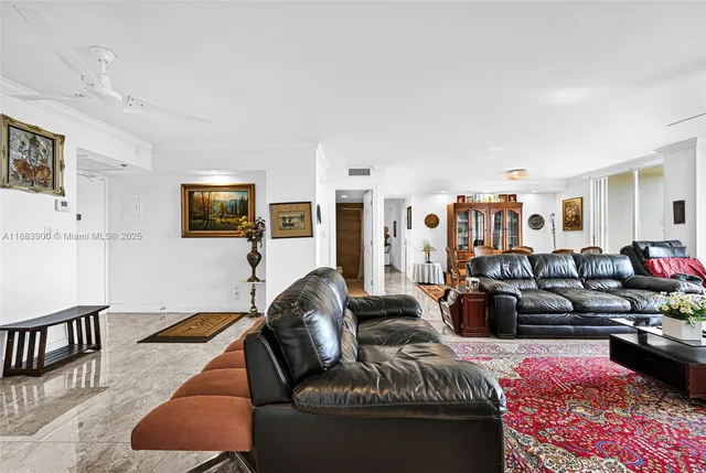 a living room with furniture a lamp and a table