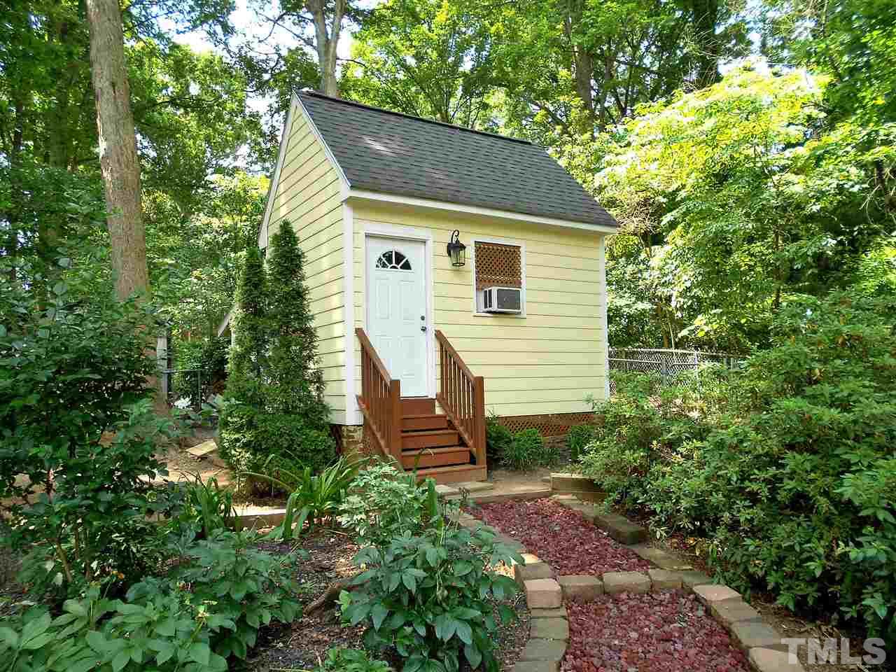 319 Glen Valley Road Raleigh, NC 27609 - Photo 20 of 25 ..has power, A/C, storage in the overhead, and a closed-in space on the back for lawn equipment. Was not built with permits, conveys "as-is".