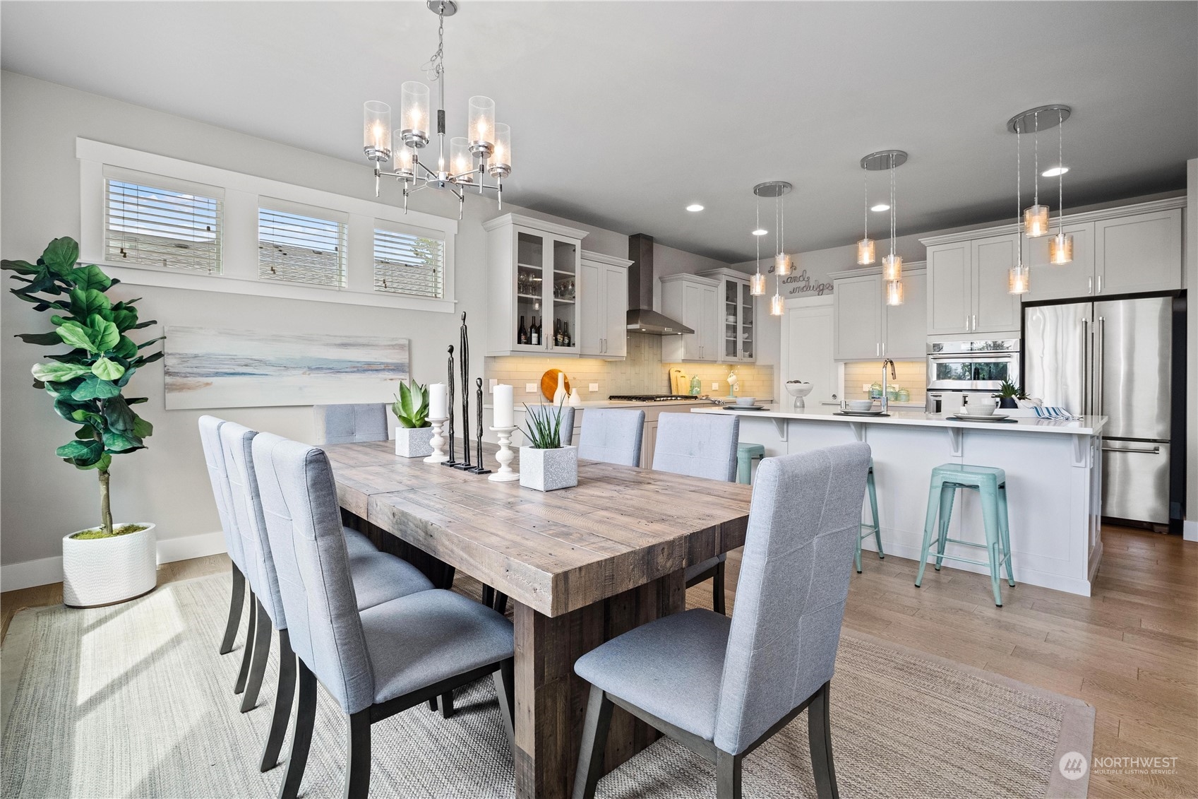 5764 Northeast 7th Court Renton, WA 98059 - Photo 11 of 40 a dining room filled chandelier and wooden floor