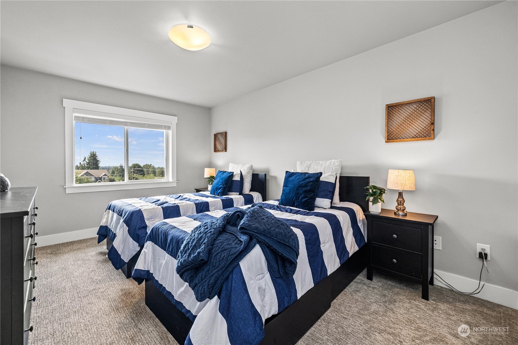 5764 Northeast 7th Court Renton, WA 98059 - Photo 19 of 40 a bed room with bed and a window