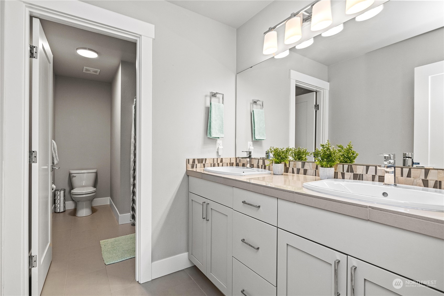 5764 Northeast 7th Court Renton, WA 98059 - Photo 21 of 40 a bathroom with a sink and a mirror