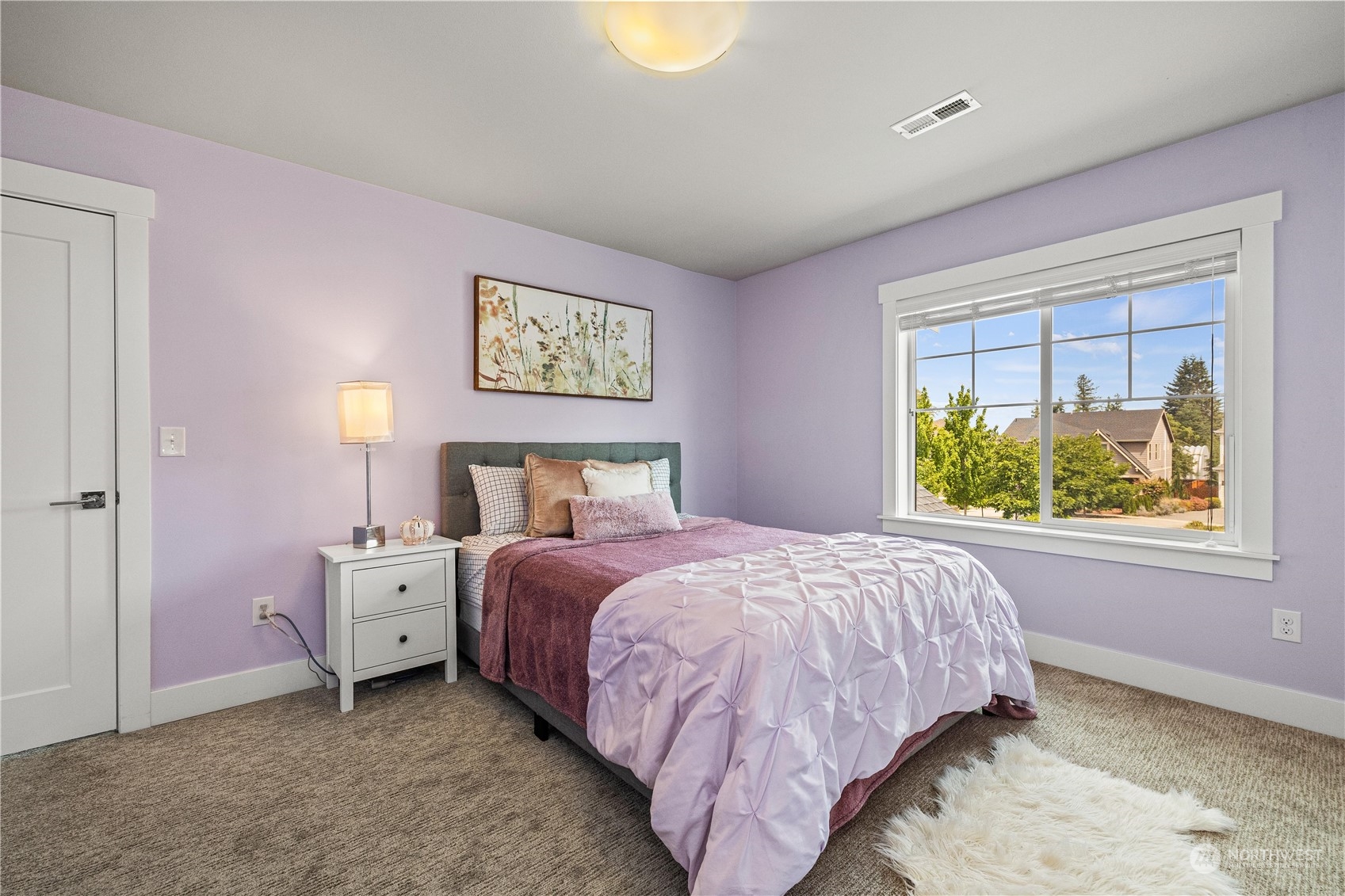 5764 Northeast 7th Court Renton, WA 98059 - Photo 23 of 40 a bedroom with a bed and a window