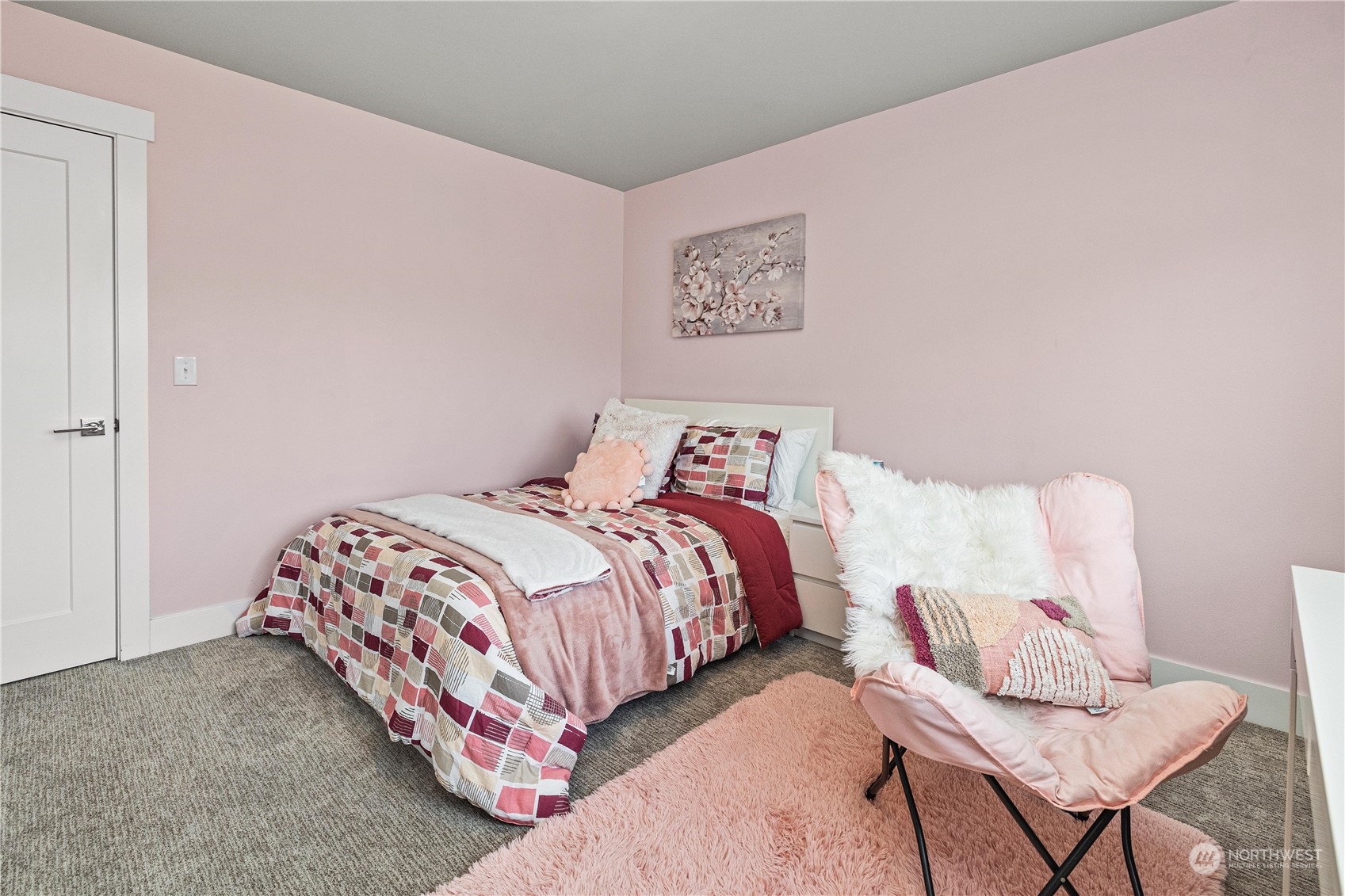 5764 Northeast 7th Court Renton, WA 98059 - Photo 26 of 40 a bedroom with a bed and chair
