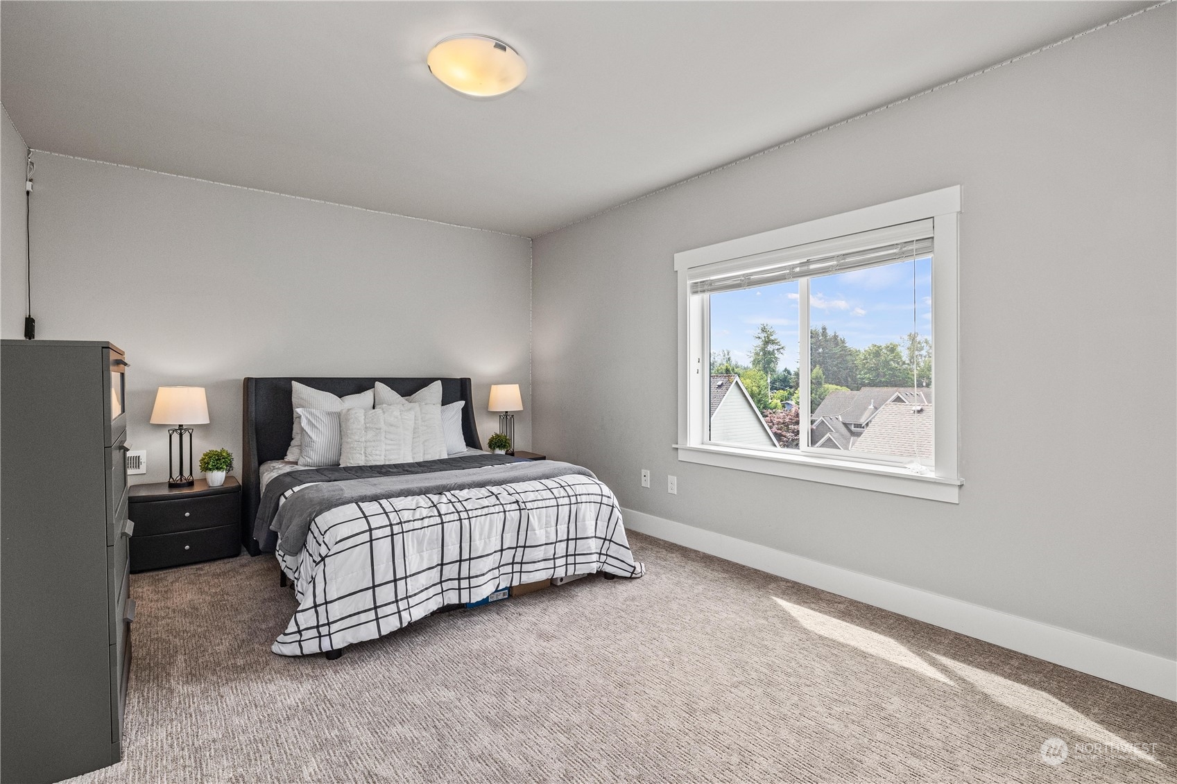 5764 Northeast 7th Court Renton, WA 98059 - Photo 30 of 40 a bedroom with a bed and a window
