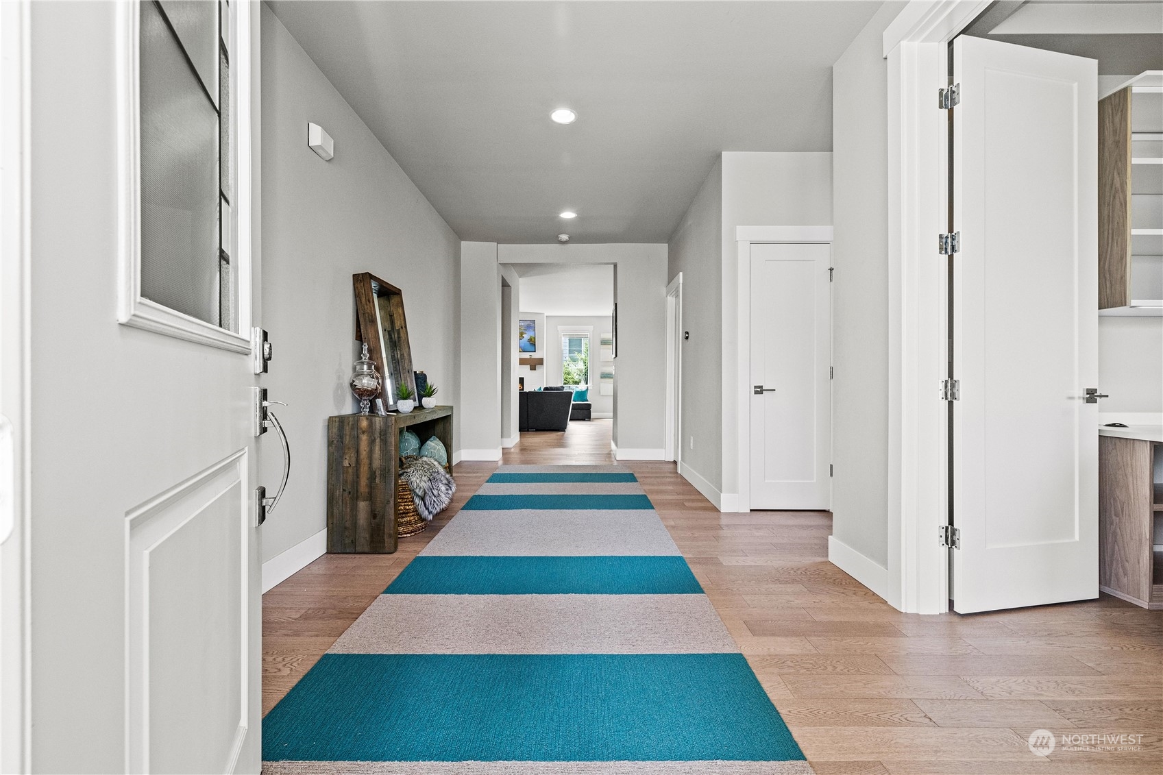 5764 Northeast 7th Court Renton, WA 98059 - Photo 3 of 40 a hallway view with a large mirror and entryway