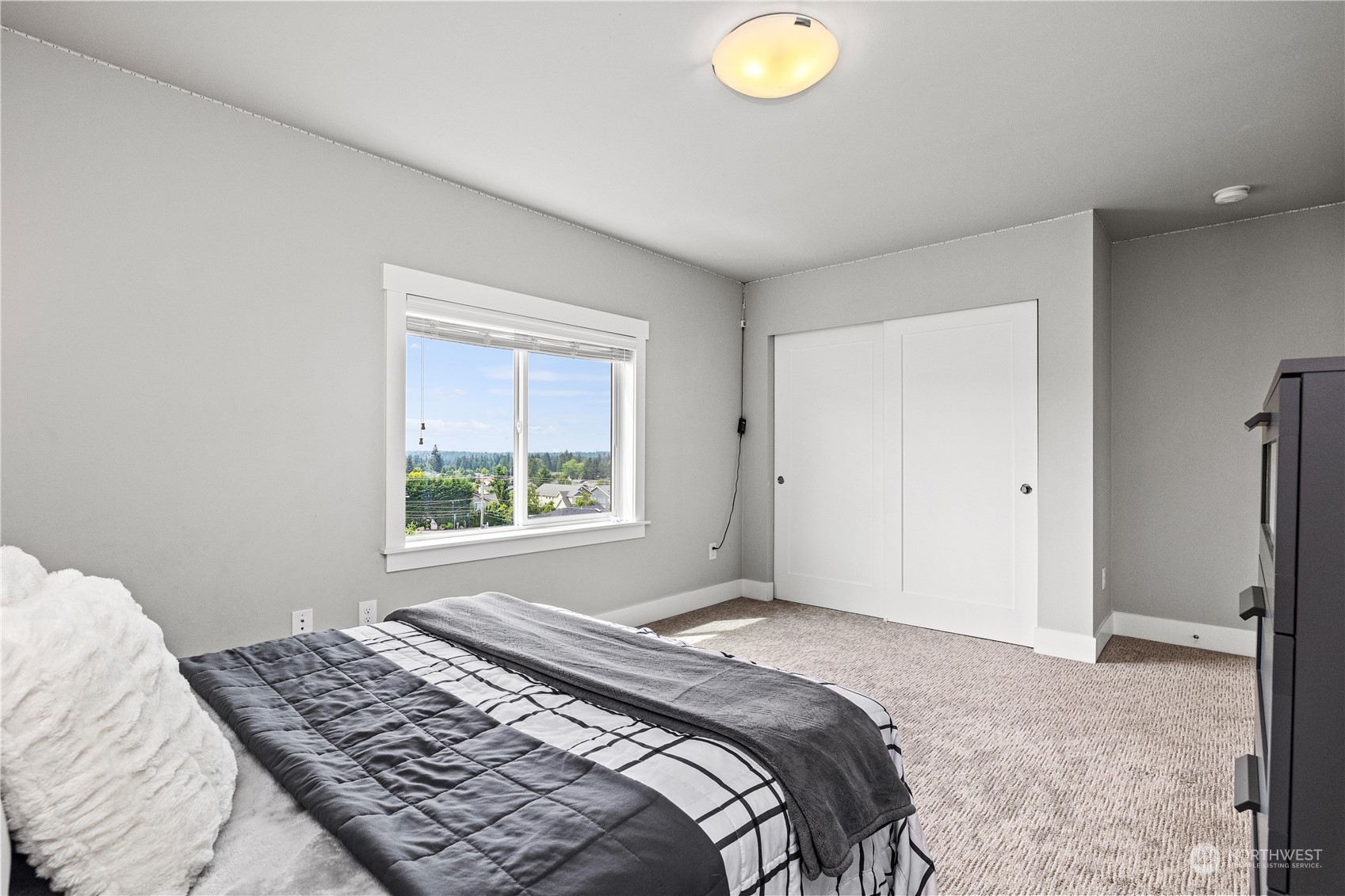 5764 Northeast 7th Court Renton, WA 98059 - Photo 31 of 40 a bedroom with a bed and a window