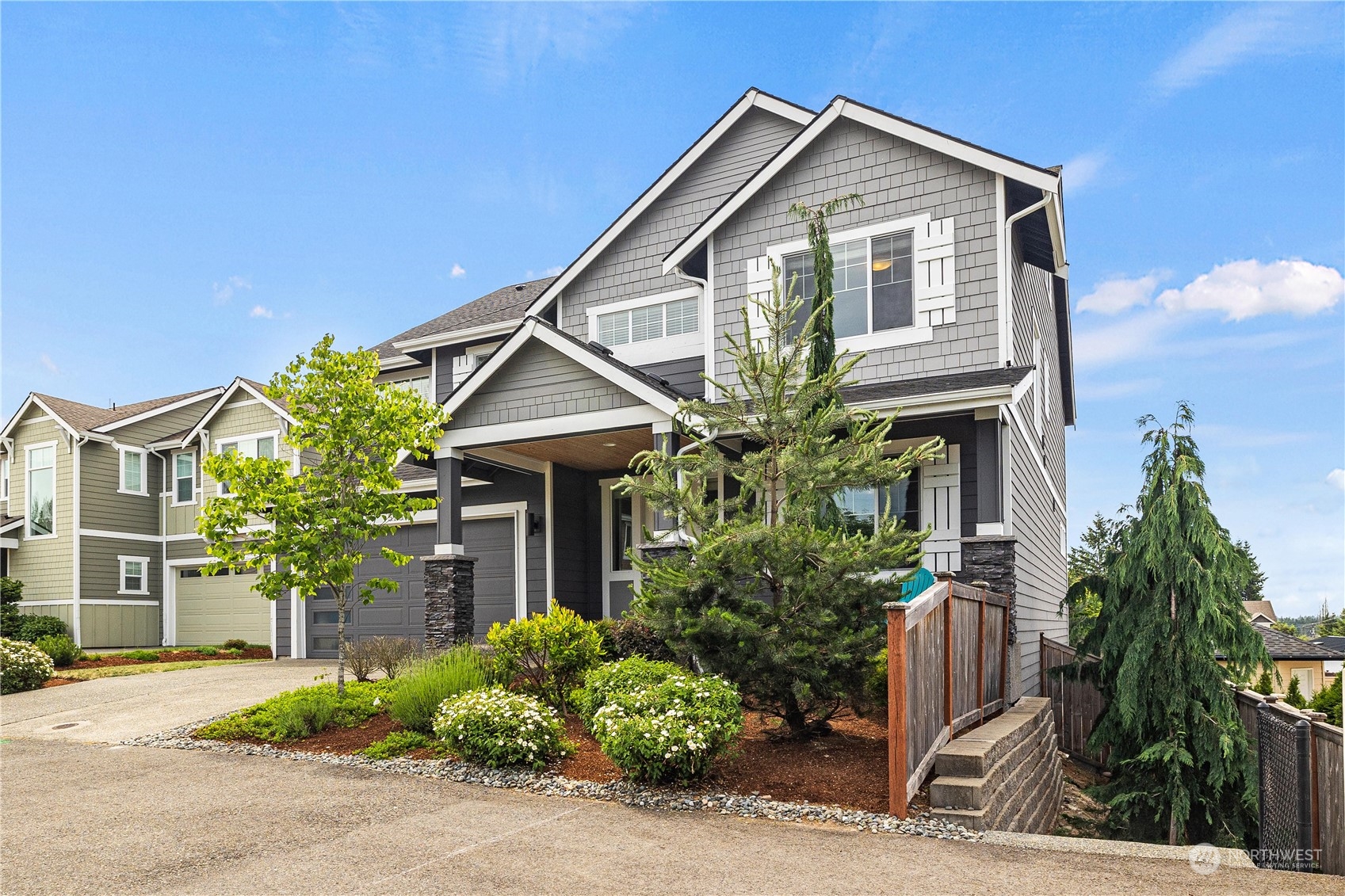 5764 Northeast 7th Court Renton, WA 98059 - Photo 38 of 40 a front view of a house with a yard