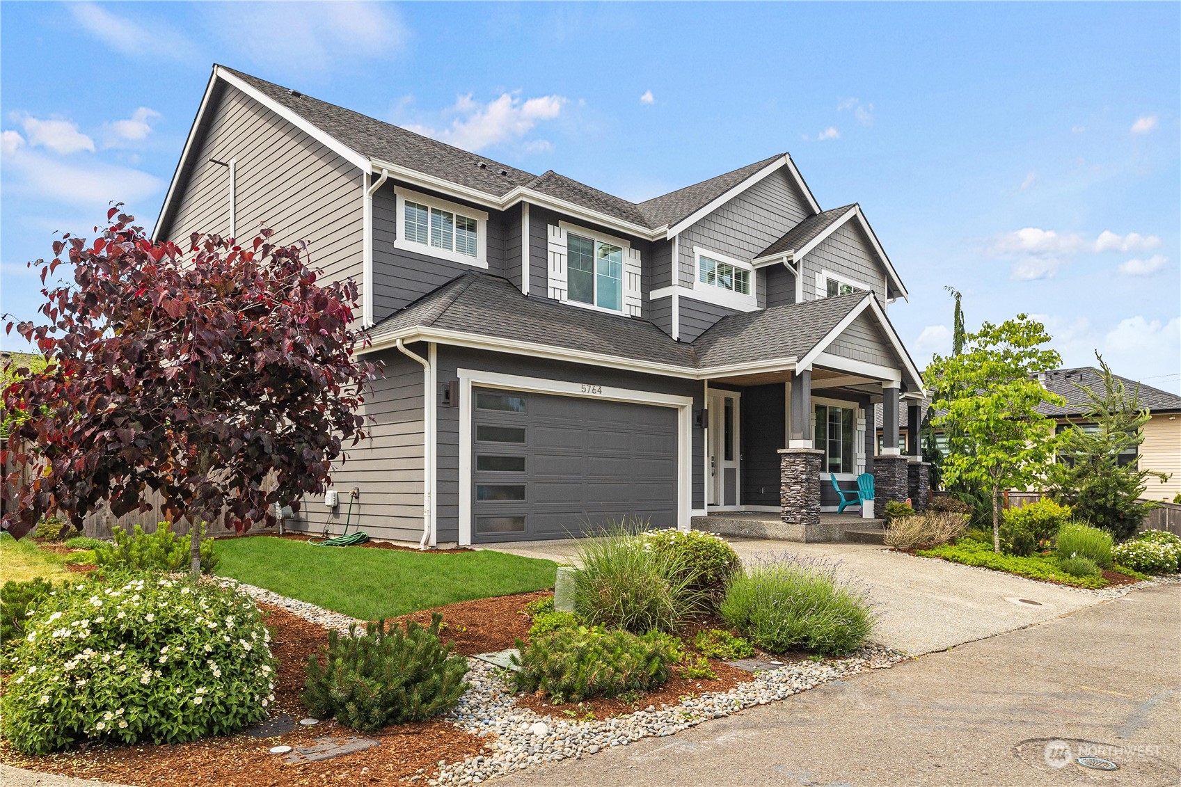 5764 Northeast 7th Court Renton, WA 98059 - Photo 39 of 40 a front view of a house with garden
