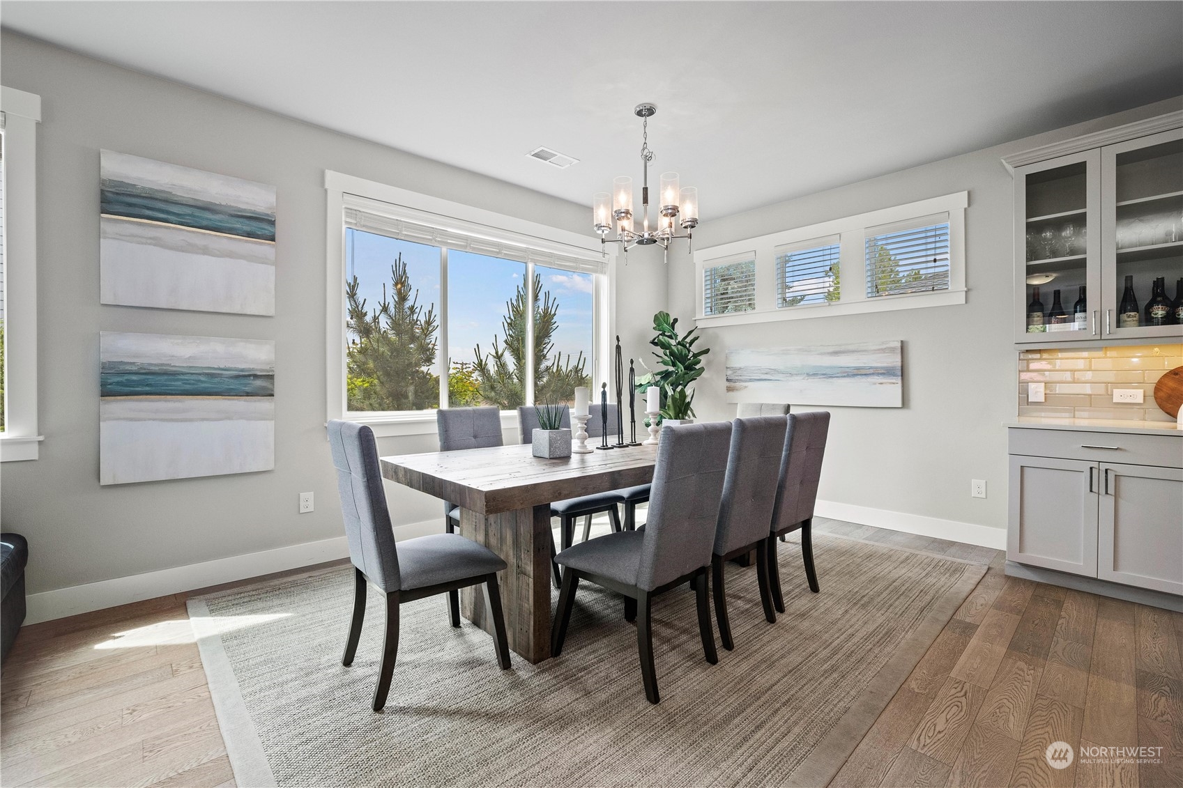 5764 Northeast 7th Court Renton, WA 98059 - Photo 10 of 40 a view of a dining room with furniture window and wooden floor