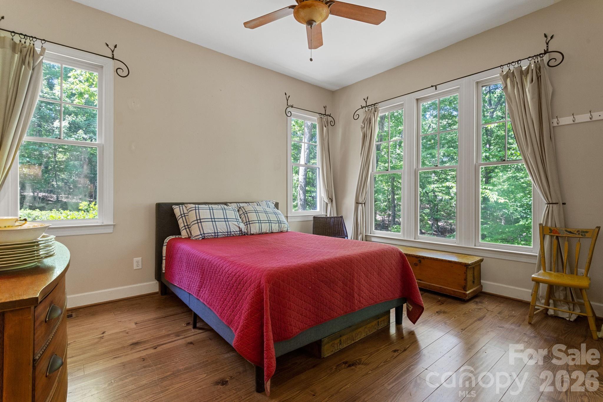 2825 Hunting Country Road Tryon, NC 28782 - Photo 17 of 41 a bedroom with a bed and a window