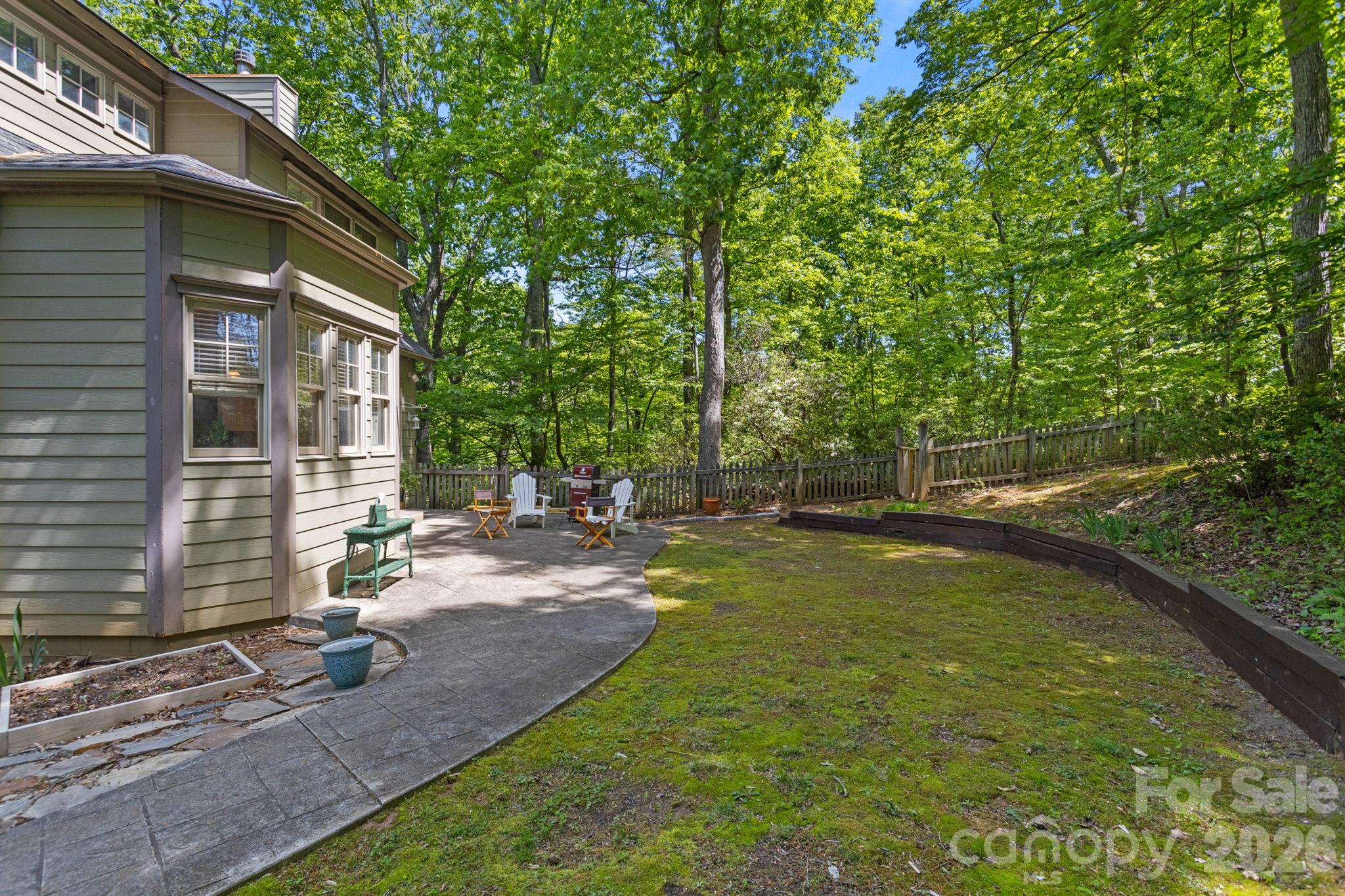 2825 Hunting Country Road Tryon, NC 28782 - Photo 4 of 41 a view of a patio with chairs and plants