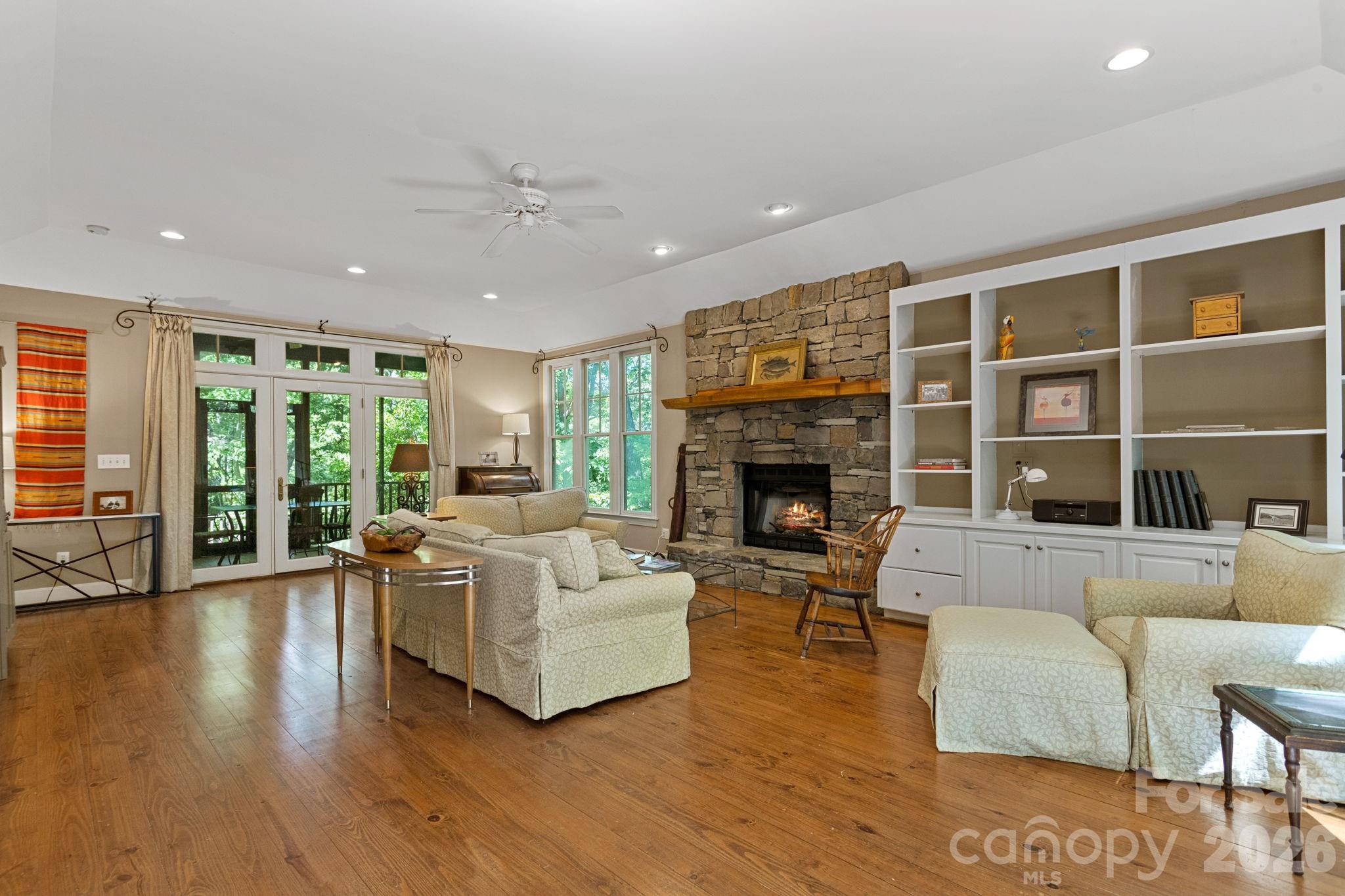 2825 Hunting Country Road Tryon, NC 28782 - Photo 6 of 41 a living room with furniture and a fireplace