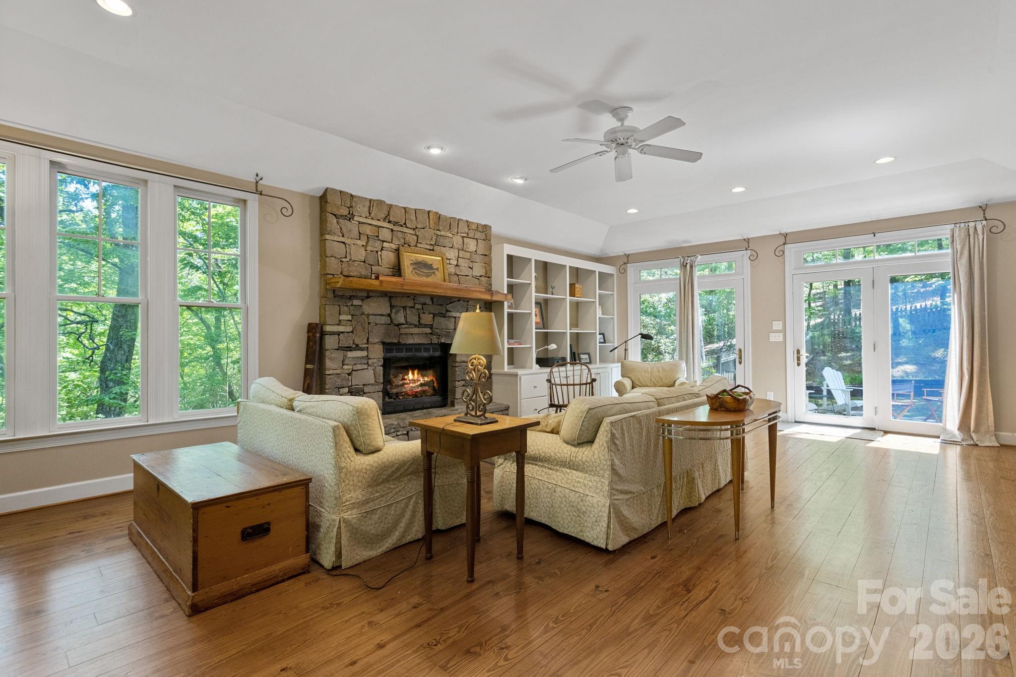2825 Hunting Country Road Tryon, NC 28782 - Photo 7 of 41 a living room with fireplace furniture and a large window