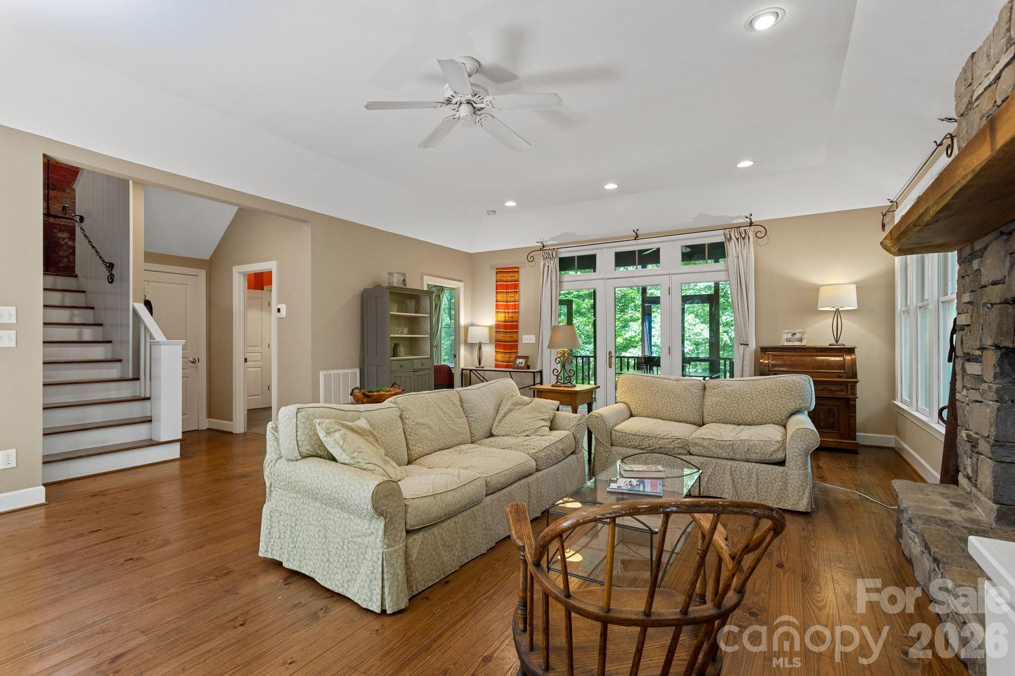 2825 Hunting Country Road Tryon, NC 28782 - Photo 9 of 41 a living room with furniture a ceiling fan and a wooden floor