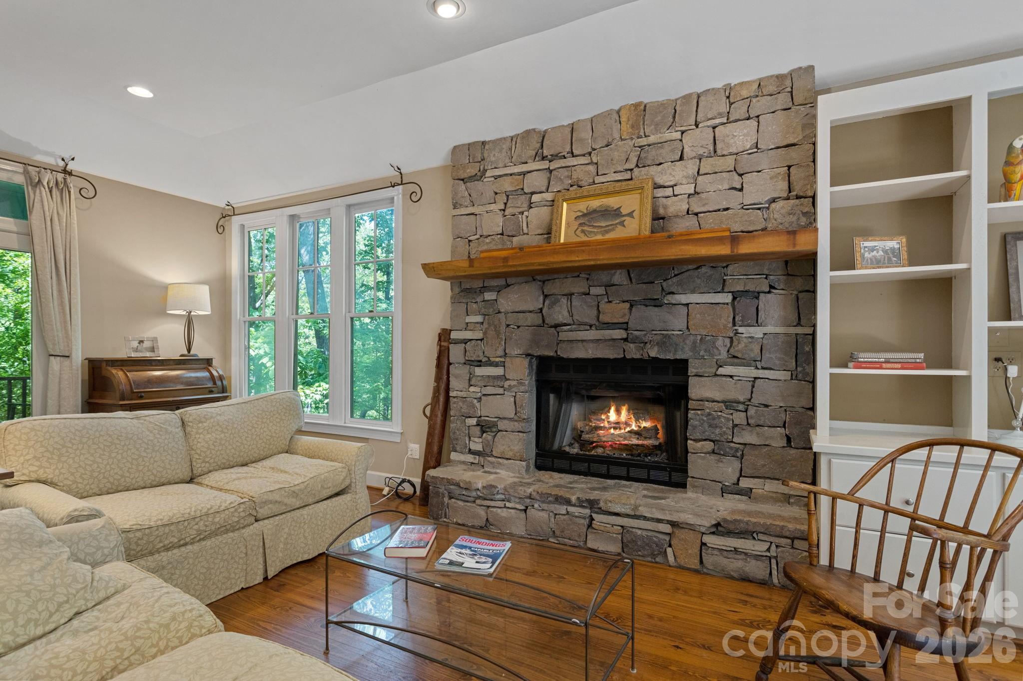 2825 Hunting Country Road Tryon, NC 28782 - Photo 10 of 41 a living room with furniture and a fireplace