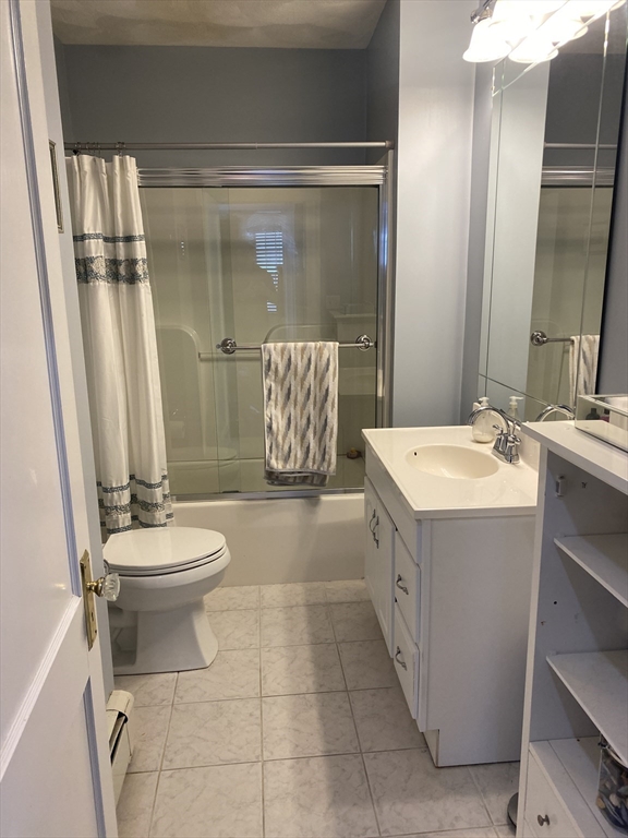 876 Shirley Street, Unit 1 Winthrop, MA 02152 - Photo 5 of 14 a bathroom with a sink a toilet and shower