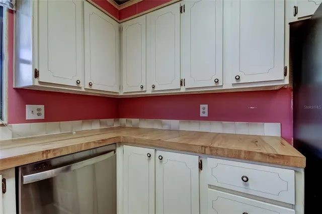 a view of kitchen cabinets and oven