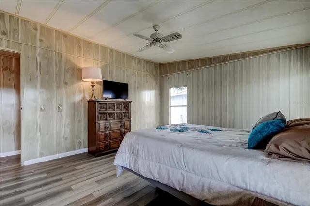 a bedroom with a bed and a fireplace