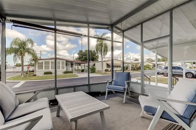 a outdoor space with a large window and couch