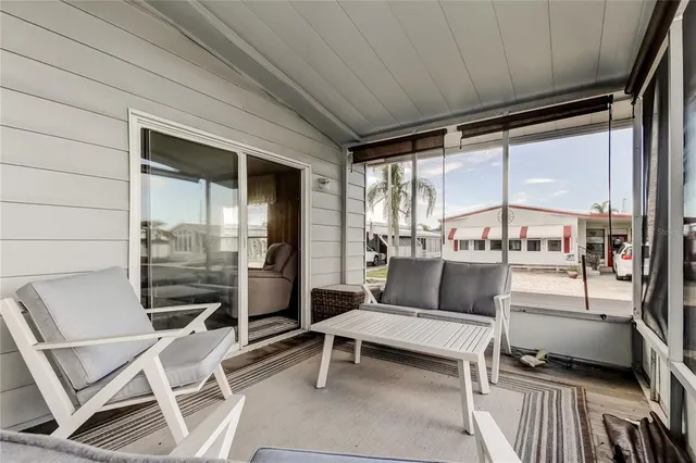 a view of a porch with wooden floor and stairs
