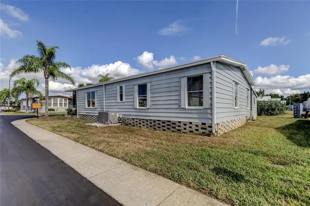 a view of a patio with table and chairs potted plants with wooden floor