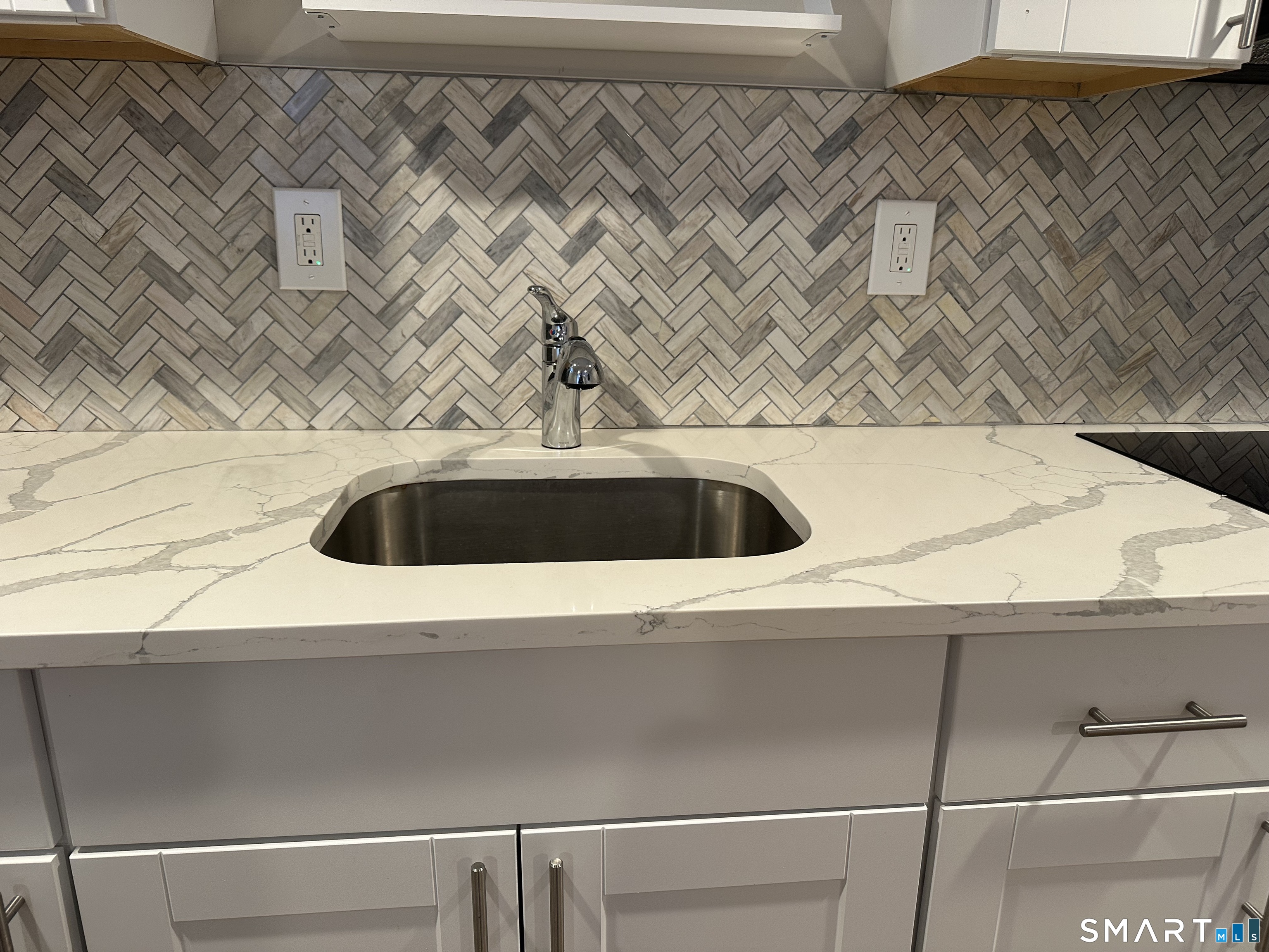2 Hurd Street Shelton, CT 06484 - Photo 6 of 19 Note the beautiful herringbone pattern tile backsplash and quartz countertop.