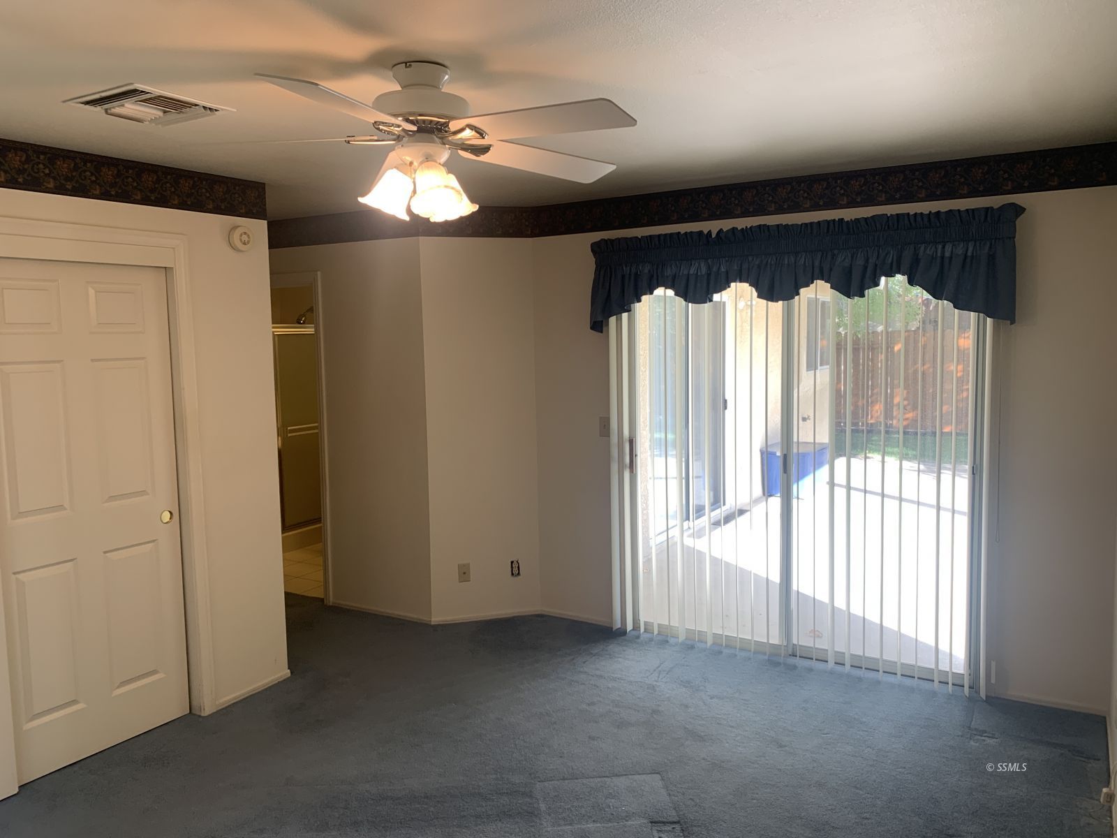 328 Ashton Street Ridgecrest, CA 93555 - Photo 18 of 28 a view of room with window and chandelier