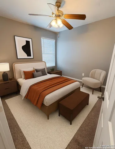 a bedroom with bed and a chandelier