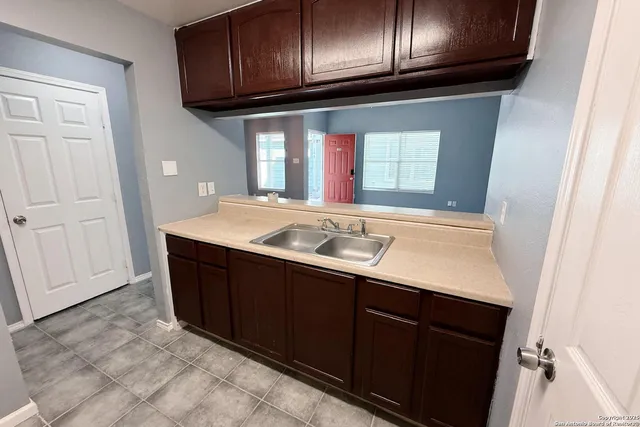 a sink with cabinets