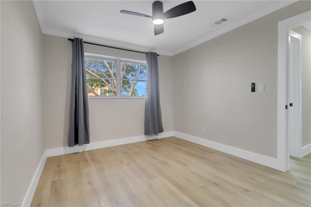 1195 Clam Court, Unit 202 Naples, FL 34102 - Photo 16 of 18 wooden floor in an empty room