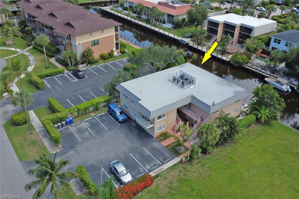 1195 Clam Court, Unit 202 Naples, FL 34102 - Photo 3 of 18 an aerial view of a house with a garden